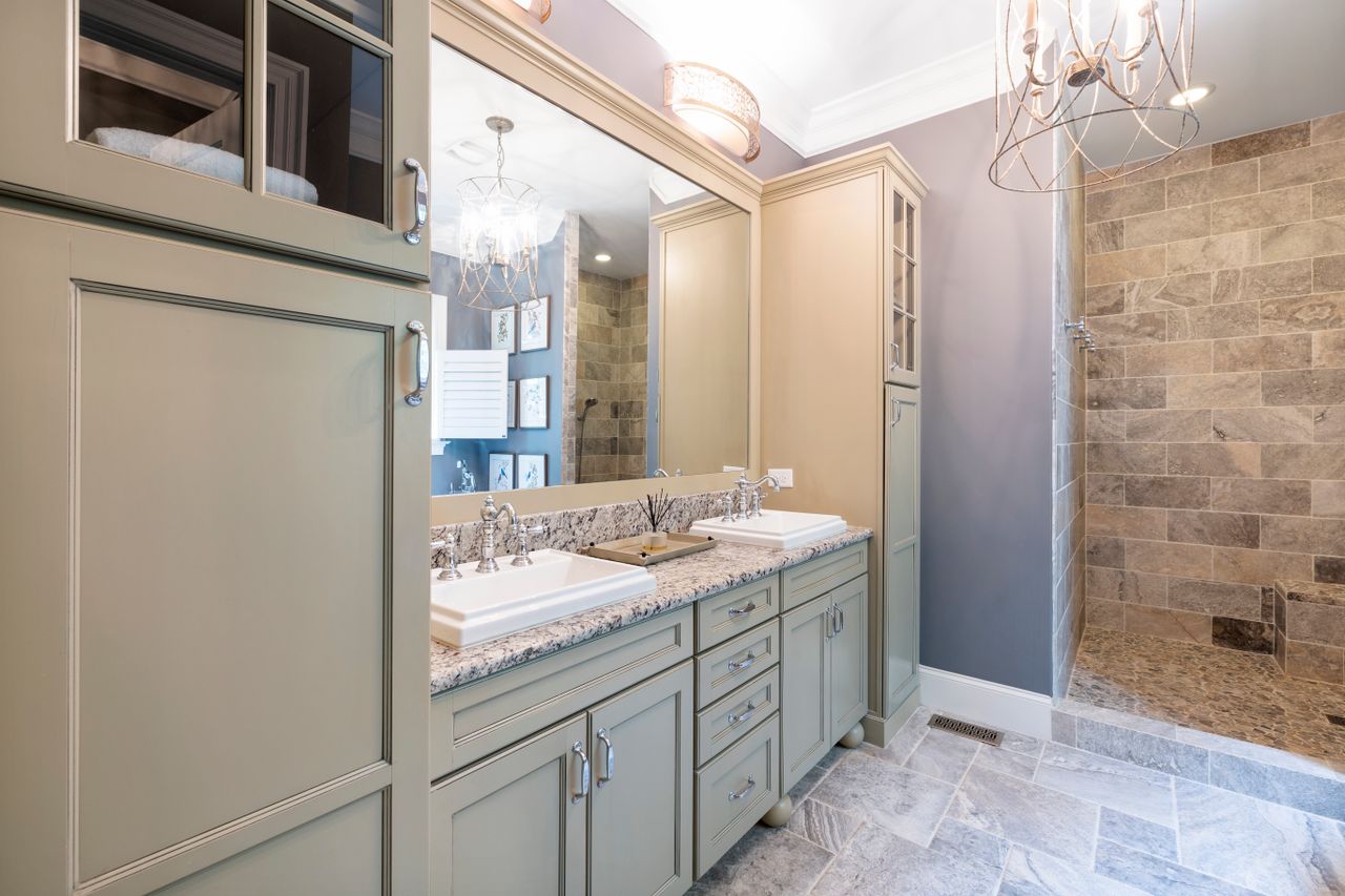 About Contemporary bathroom featuring stylish cabinetry and a sleek walk-in shower.